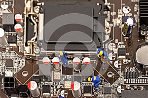 Miniature Group Engineers inspecting computer processor with chip and repairing