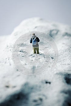 Miniature hikker in a snowy landscape photo