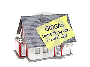 Miniature house with the german words for natural gas conversion from L to H Gas - Erdgasumstellung