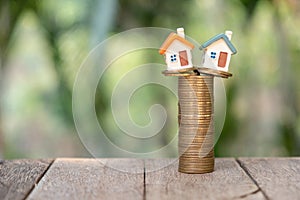 Miniature house models and stacked coins Investment risk Business growth Real estate investment and home mortgages, financial real