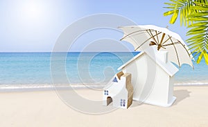 Miniature house on tropical beach, vacation and holiday accommodation