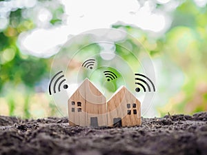 Miniature house with Wifi signal. The concept of network connect, internet of thinks, smart home control and automation system