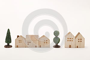 Miniature houses and trees on white background. Building