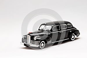 Miniature model of a Russian retro car on a white background