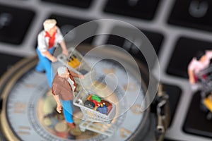 Miniature models of various shopping on computer keyboards and pocket watches