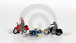 Miniature motorcycle rider. Miniature motorcycle driver who crashed.