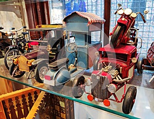 Miniature multi-colored collectible models of vintage cars in the shop window
