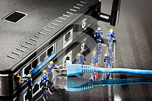 Miniature Network Engineers At Work. Technology concept photo