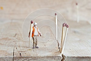 Miniature people in action with matchsticks