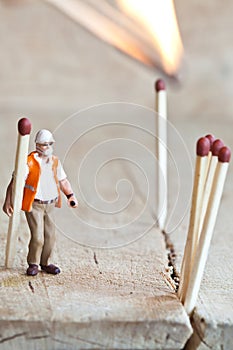Miniature people in action with matchsticks