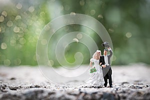 Miniature people : Bride and groom couple standing outdoor