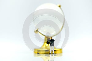 Miniature people : Businessman with glass globe.