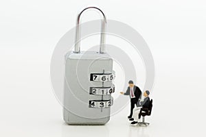 Miniature people: Businessman looking for password of security key. Image use for background security system, hack, business