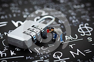 Miniature people: Businessman and master key encoding. Image use for background security system, hack, business concept