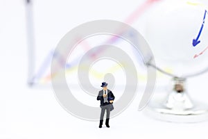 Miniature people: Businessman stand front of dashboard, display graphs, profit margins of  background. Image use for business