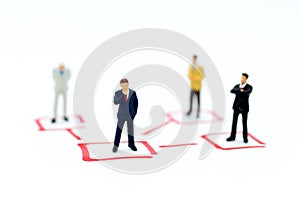 Miniature people: Businessman stand in various positions. Image use for business cycle, responsibility