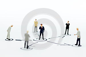 Miniature people: Businessman stand in various positions. Image use for business cycle, responsibility