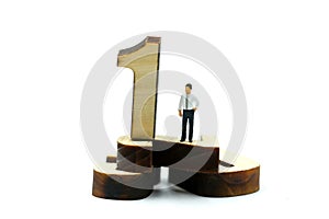 Miniature people : Businessman standing wooden number of 1,2,3