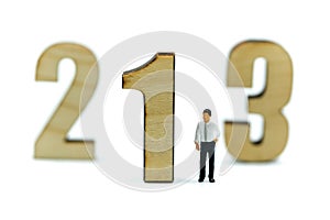 Miniature people : Businessman standing wooden number of 1,2,3