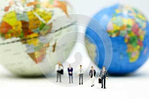 Miniature people : Businessman team with miniworld ,International business concept