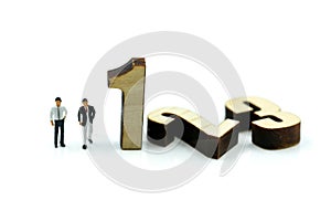 Miniature people : Businessman and team with wooden number of 1,2,3 , to be the first,business competition concept.