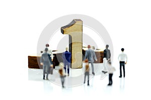 Miniature people : Businessman and team with wooden number of 1,2,3 , to be the first,business competition concept.