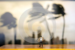 Miniature people : businessman and Tie blowing in wind stand wi