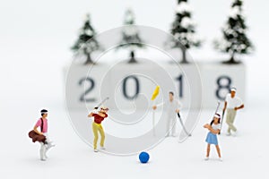 Miniature people : Businessmen spend their free time for Golf activities. Image use for sport, hobbies concept