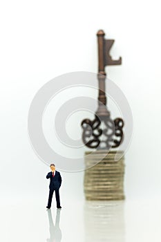 Miniature people: Businessmen stand with keys. Image use for key man, the key to success, business concept