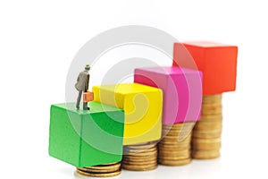 Miniature people: Businessmen standing with coins stack, Finance, investment and growth in business concept