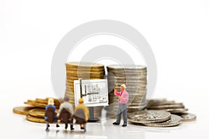 Miniature people: Businessmen standing with coins stack, Finance, investment and growth in business concept