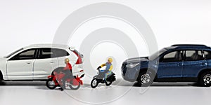 A motorcycle rider who forcefully intervenes between two cars. Concept on the importance of safe driving and the risk of accidents photo