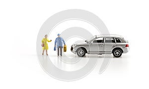 Miniature people with car photo