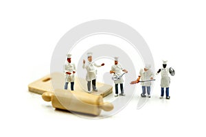 Miniature people : Chef during cooking and working on white back