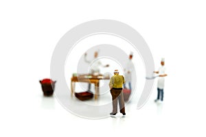 Miniature people : chef and people buying fruits and vegetables