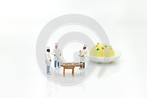 Miniature people: Chefs choose best raw materials for cooking for consumers. Image use for food and beverage concept, business