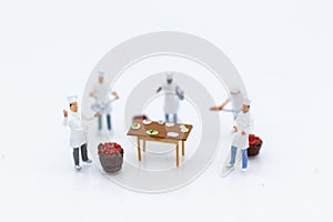 Miniature people: Chefs choose best raw materials for cooking for consumers. Image use for food and beverage concept, business co