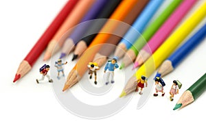 Miniature people : children and student with colorful drawing tools and stationary,education concept