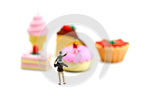 Miniature people : children,student with dessert.fun and food co