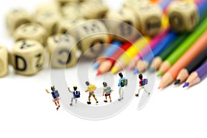 Miniature people : children and student with stationary,education concept