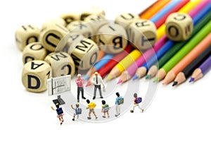 Miniature people : children and student with stationary,education concept