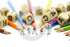 Miniature people : children and student with stationary,education concept