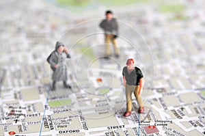 Miniature people and city map photo