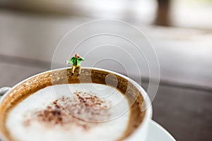 Miniature people : Coffee cup with businessman , image use for charge your energy in the morning
