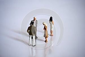 Miniature people. The concept of bullying in the workplace.