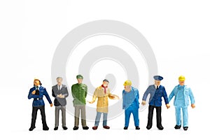 Miniature people different professions standing on white background , Labour day concept