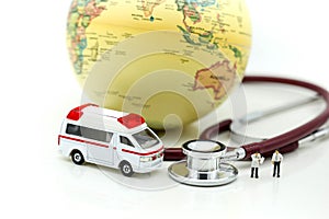 Miniature people : Doctor and Paramedic attending to patient in