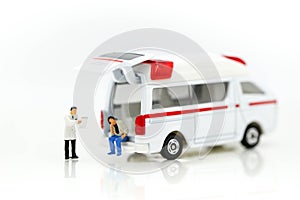 Miniature people : Doctor and Paramedic attending to patient in