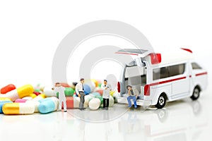 Miniature people : Doctor and Paramedic attending to patient in