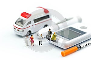 Miniature people : Doctor and Paramedic attending to patient in